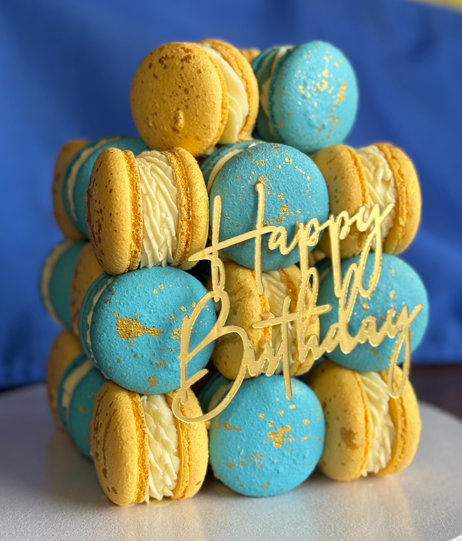 A cube cake built entirely from macarons